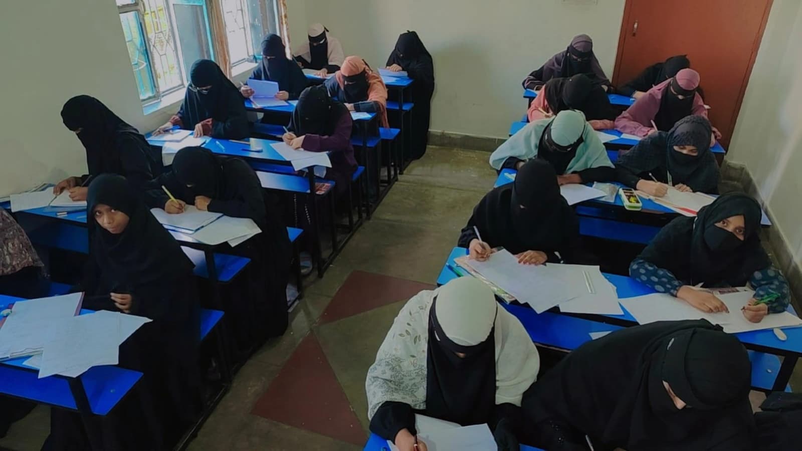 Students writing at their desks
